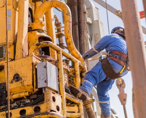 Worker Harnessed On Oil Rig