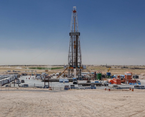 Side View Of An Oil Drilling Rig In Desert