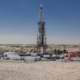 Side View Of An Oil Drilling Rig In Desert